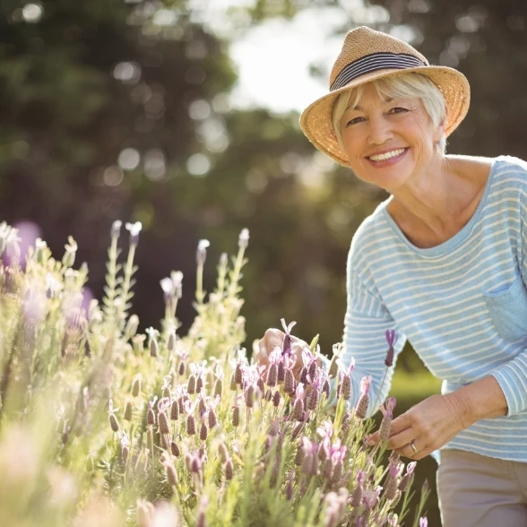 Happy senior woman enjoying gardening